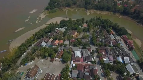 Town with red roofs on mountain and river aerial view. Luang Prabang, Laos. Stock Footage 102857787