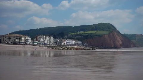 The town of Sidmouth in Devon.  Pebble beach and low tide Video stock 156186421