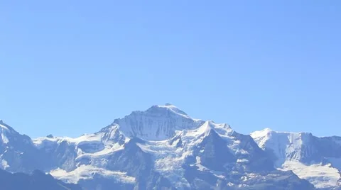 A Town Sitting Below an Impressive Mountain in Swiss Alps Stock Footage 21376690