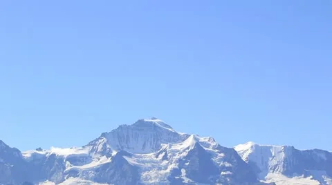 Town Sitting Below Impressive Snowcapped Mountain Stock Footage 21376675