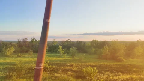 Town train road trip side window with a beautiful landscape. Nature green hills Vidéo 154628844