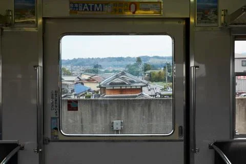 Towns pass through a train window, Japan Stock Photos