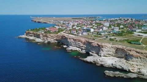 Townscape on peninsula with rocky coastline Stock Footage 299680201