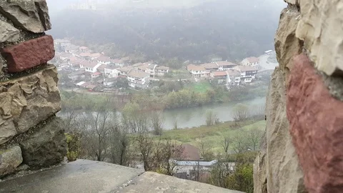 Townscape with river in Bulgaria, viewed from mediaeval fortress above Vídeos de archivo 104719060