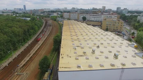 Townscape with train ride near storage of DHL company Stock Footage 70956816