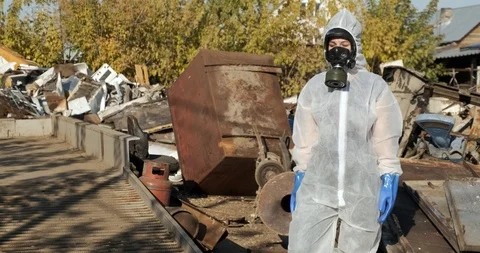Toxic air, area needs to be cleaned, biologist in protective suit, dangerous air Stock Footage 119051819