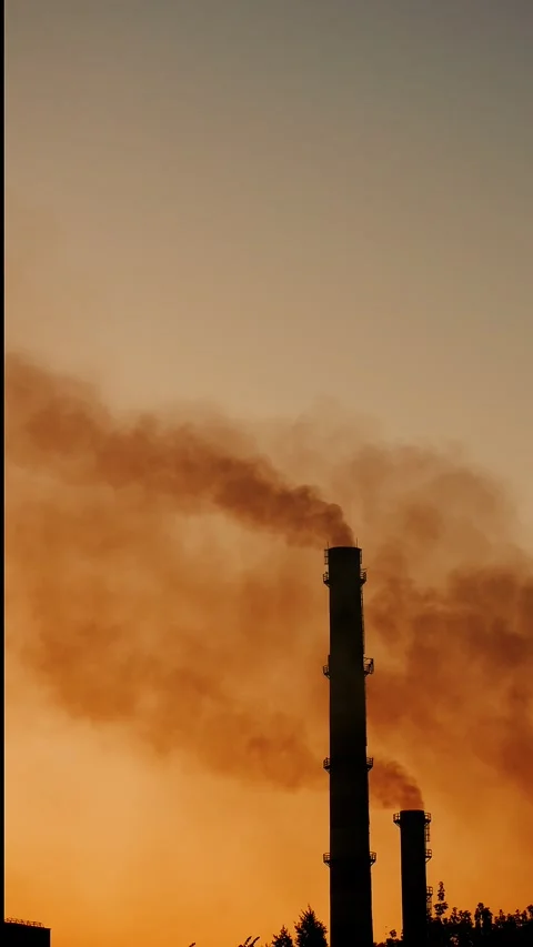 Toxic clouds of black smoke emitted by an industrial plant. Stock Footage 316993293