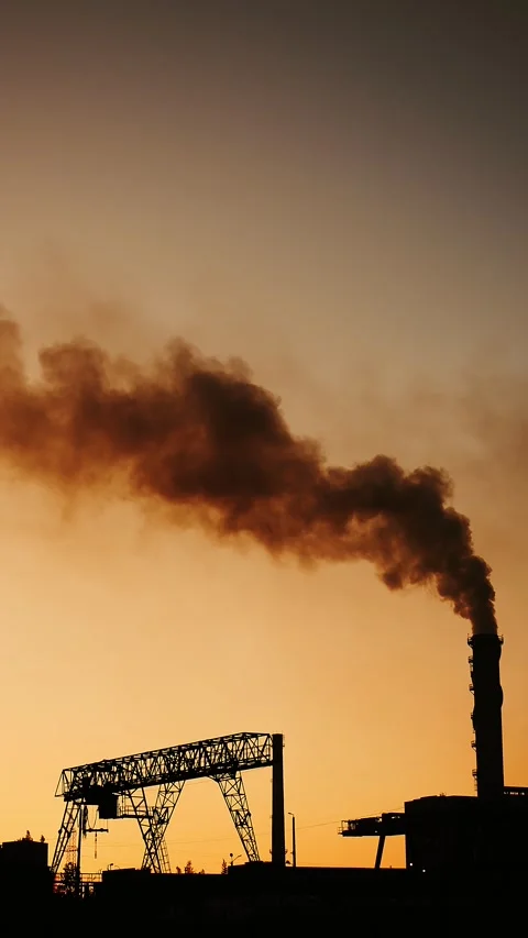 Toxic clouds of black smoke emitted by an industrial plant. Stock Footage 316993302