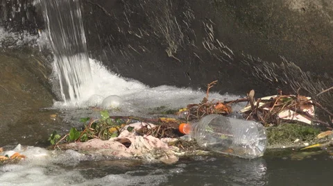 Toxic garbage river pollution plastic bottle float unhealthy city ecology dirty Stock Footage 43140763