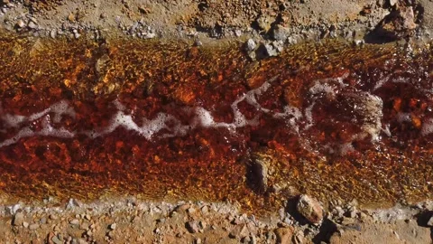 Toxic gold mining residual waters flowing and polluting environment Stock Footage 337693962
