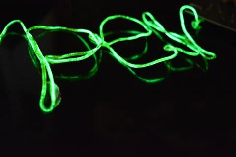 Toxic green lime lighting with specific pattern neon electroluminescent wire. Stock Photos