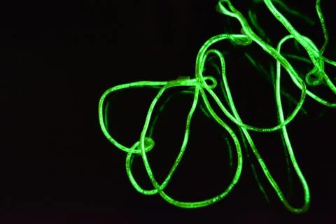 Toxic green lime lighting with specific pattern neon electroluminescent wire. Stock Photos