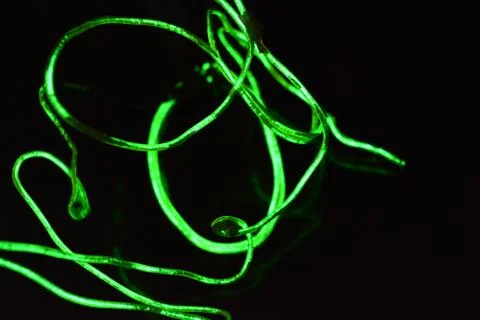 Toxic green lime lighting with specific pattern neon electroluminescent wire. Stock Photos