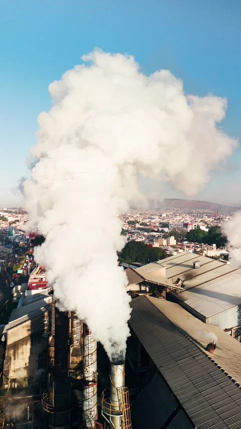Toxic smoke cloud coming out of the pipes of industrial plant Stock Footage 296651251