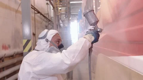 Toxic work at the car factory in the paint shop. Close-up of the face of a man Stock Footage 196358066