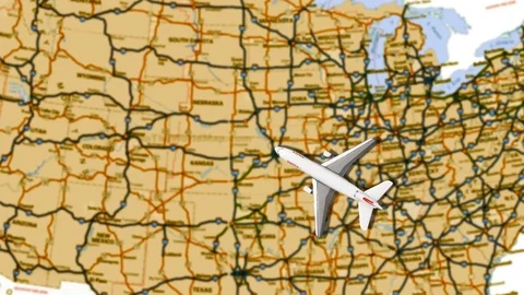 Toy airplane moving across a map of USA Stock Footage 112735344