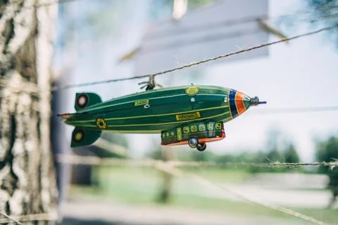 A toy airship hangs on a string Stock Photos