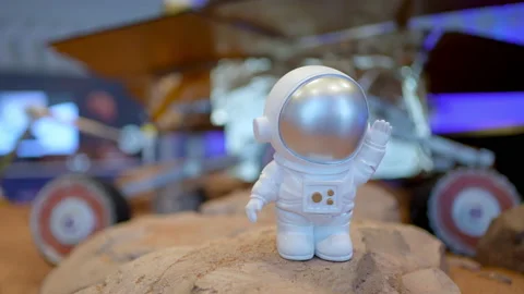Toy astronaut rocket planets at space. Little pilot cosmonaut playing at Mars Stock Footage 170832090