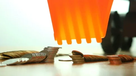 Toy backhoe  with pile of coin, in studio Chiangmai Thailand Stock Footage 112172323