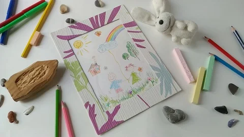 Toy ball rolling through a children's drawing Stock Footage 108402990