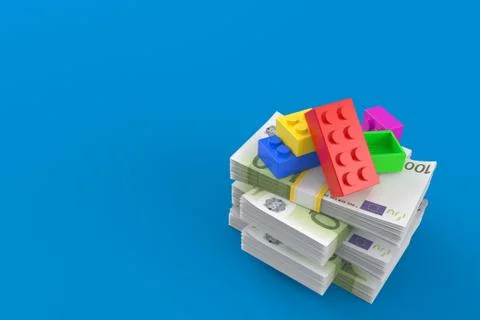 Toy block on stack of money Stock Illustration