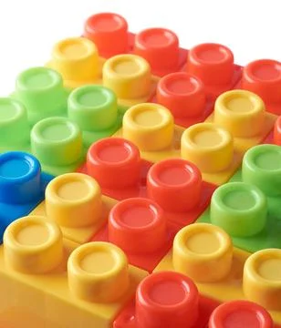 Toy blocks, interlocking plastic bricks on white Stock Photos
