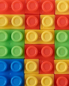 Toy blocks, interlocking plastic bricks, full frame Stock Photos