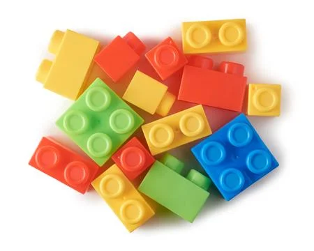 Toy blocks, interlocking plastic bricks on white Stock Photos