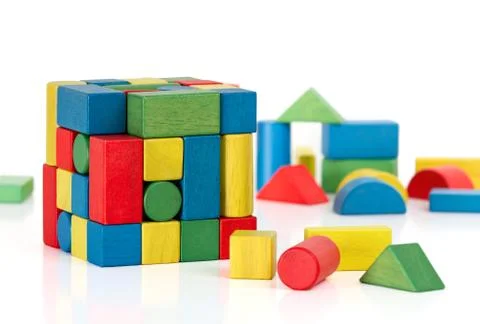 Toy blocks jigsaw cube, multicolor puzzle pieces over white background Stock Photos