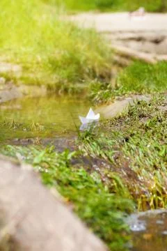 A toy boat in a stream Stock Photos