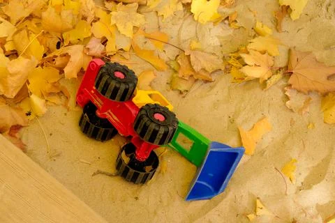 Toy bugger in a sandbox Stock Photos