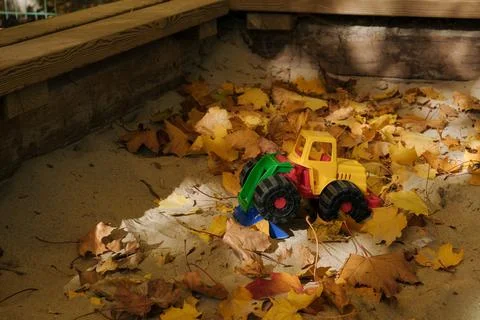 Toy bugger in a sandbox Stock-Fotos