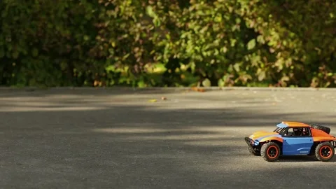 A toy buggy controlled by a remote control. Amewi Knight Dune Buggy 4WD. Stock-Footage 346205385