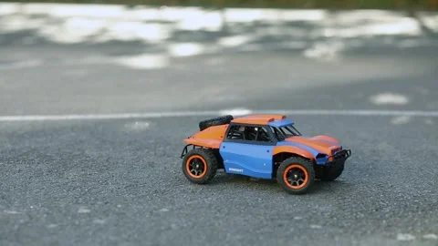 A toy buggy controlled by a remote control. Amewi Knight Dune Buggy 4WD. Stock-Footage 346205530