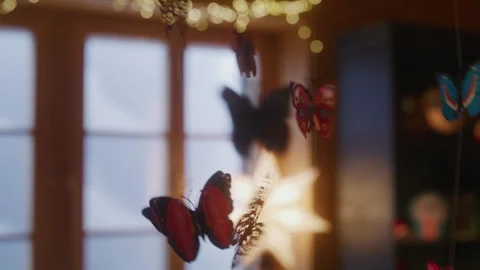 Toy butterflies hanging on strings Stock Footage 265420479