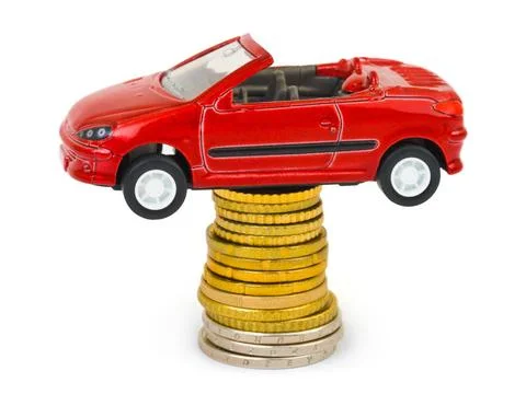 Toy car and stack of coins Toy car and stack of coins isolated on white ba... Foto stock