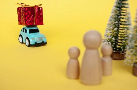 Toy car carry present while on a journey back home for Christmas. Christmas.. Stock Photos