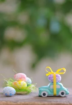 Toy car carrying easter eggs Free Stock Photos