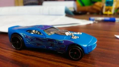 A toy car kept on a table. Stock Photos
