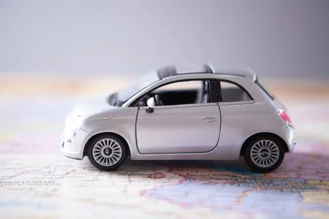 Toy car on the map Stock Photos