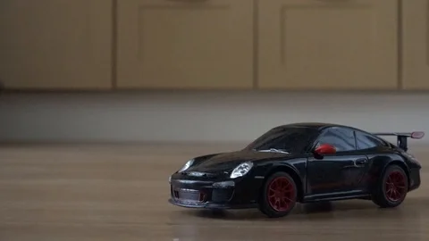 Toy car on the remote control. Black Porsche Cayenne Video stock 100289273