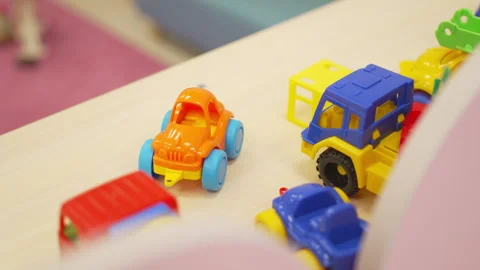 Toy cars lined up on sturdy shelf brighten cheerful kid room Stock Footage 310600341