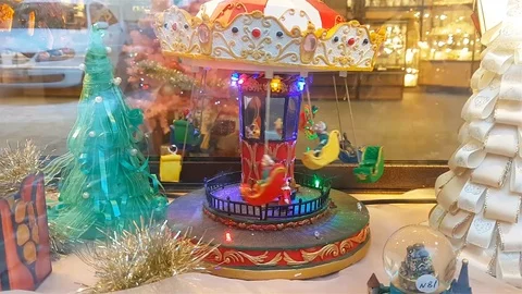 Toy chained carousel with baskets are spinning Stock Footage 87548921