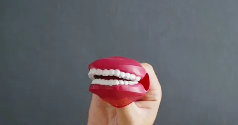 Toy chattering teeth in hand moving. Fun concepts comedy or talk bla bla bla. Stock Footage 157560362