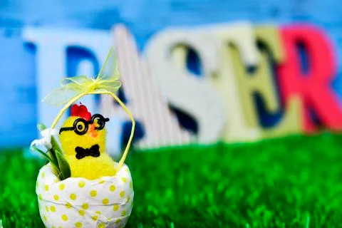 Toy chick and word easter Stock Photos