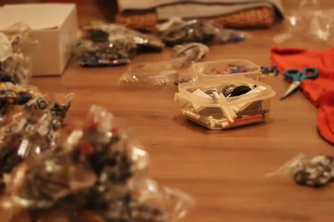 Toy components lie distributed on the floor Stock Photos