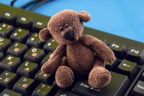 Toy on the computer keyboard Stock Photos