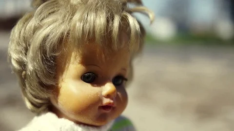 Toy doll on the road Stock Footage 75614038