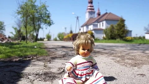 Toy doll on the road Stock Footage 75614117