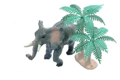 Toy Elephant with Trees Stock Photos